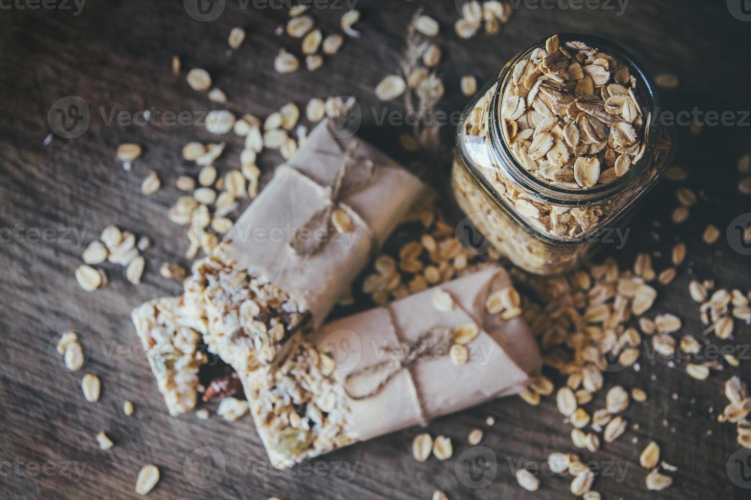 Homemade granola with nut mix on wooden board photo