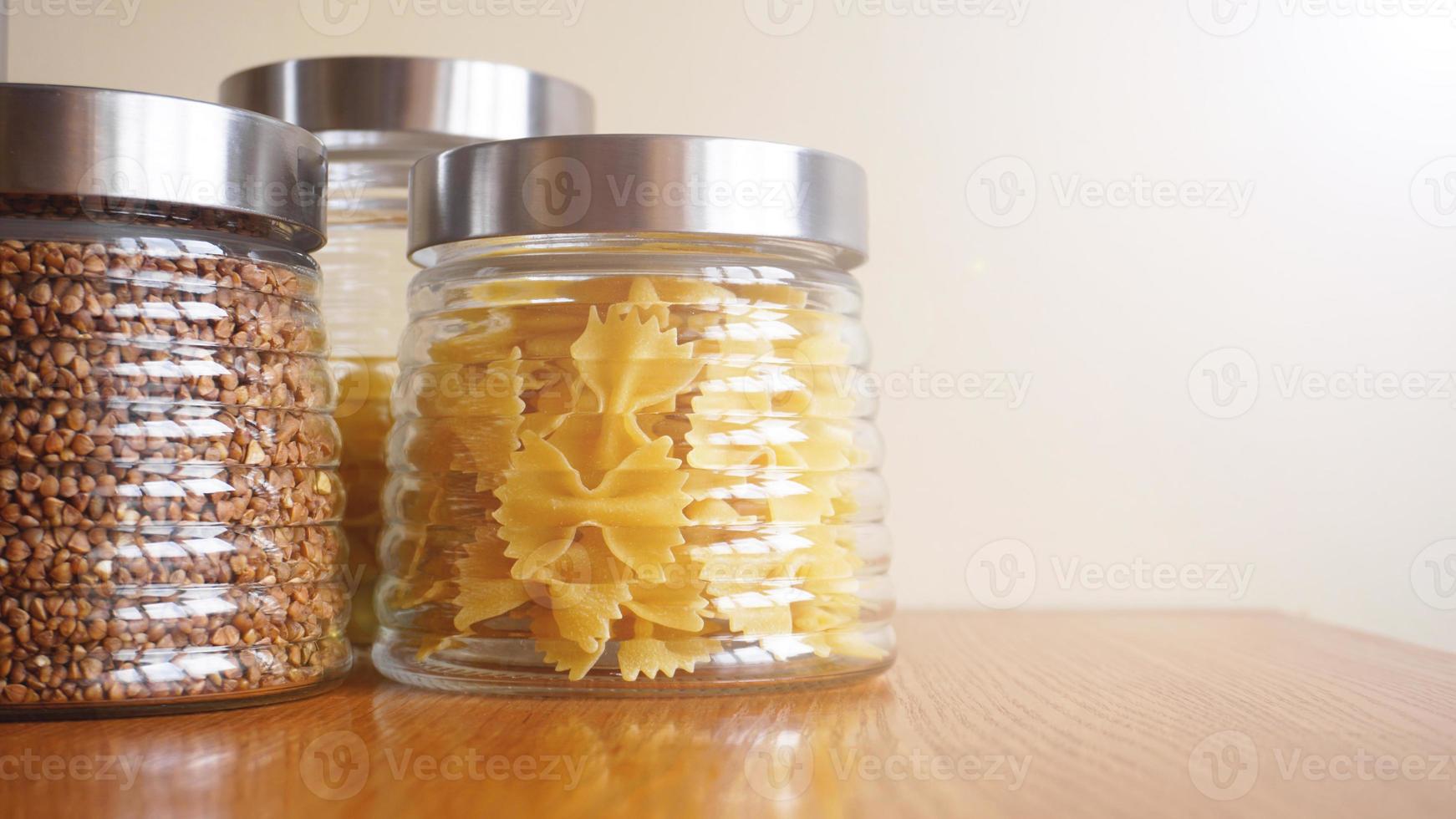 Pasta and bukwheat meals. Healthy cooking in glass containers photo