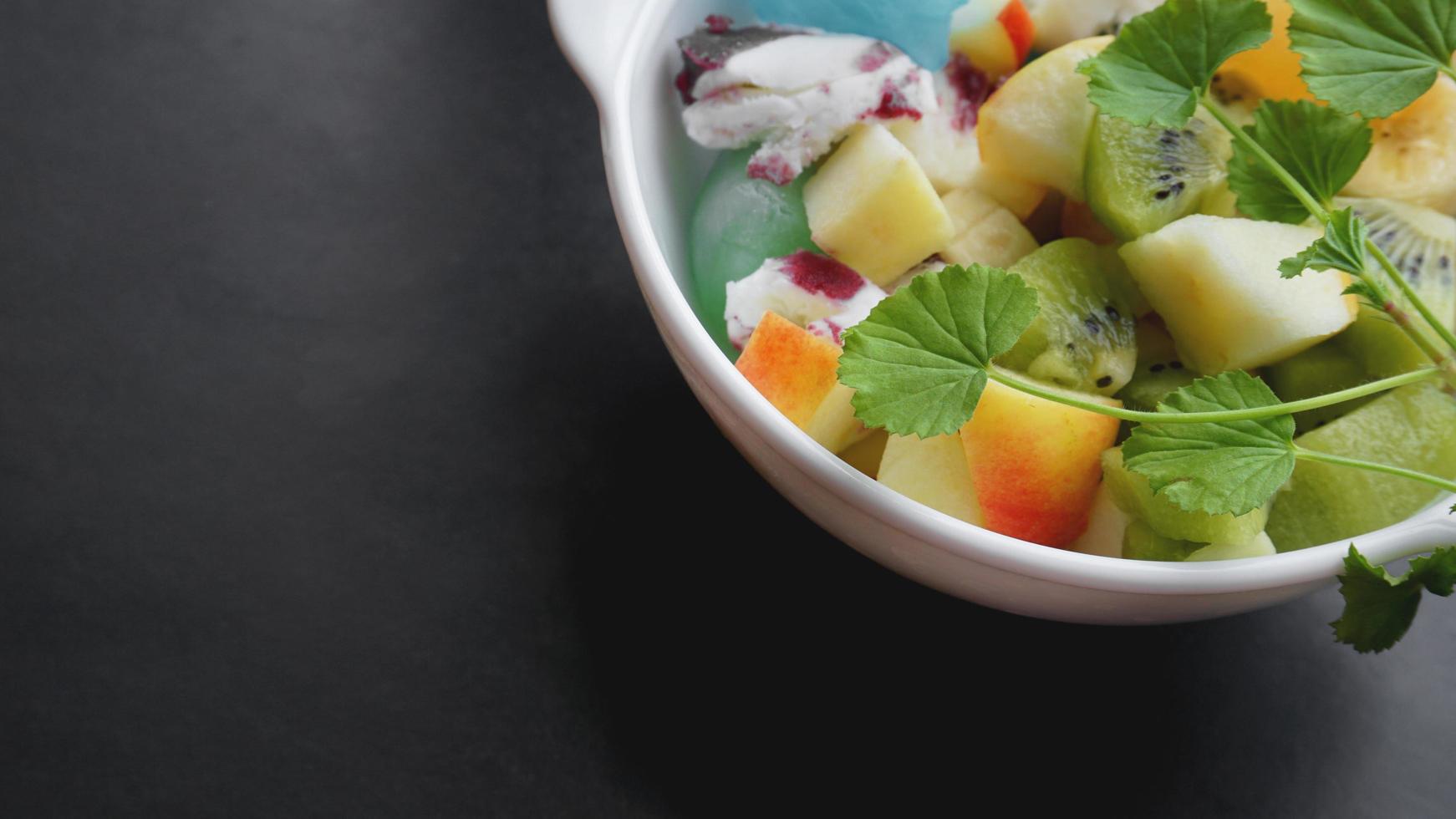 Close up desert with fresh fruit and ice cream photo