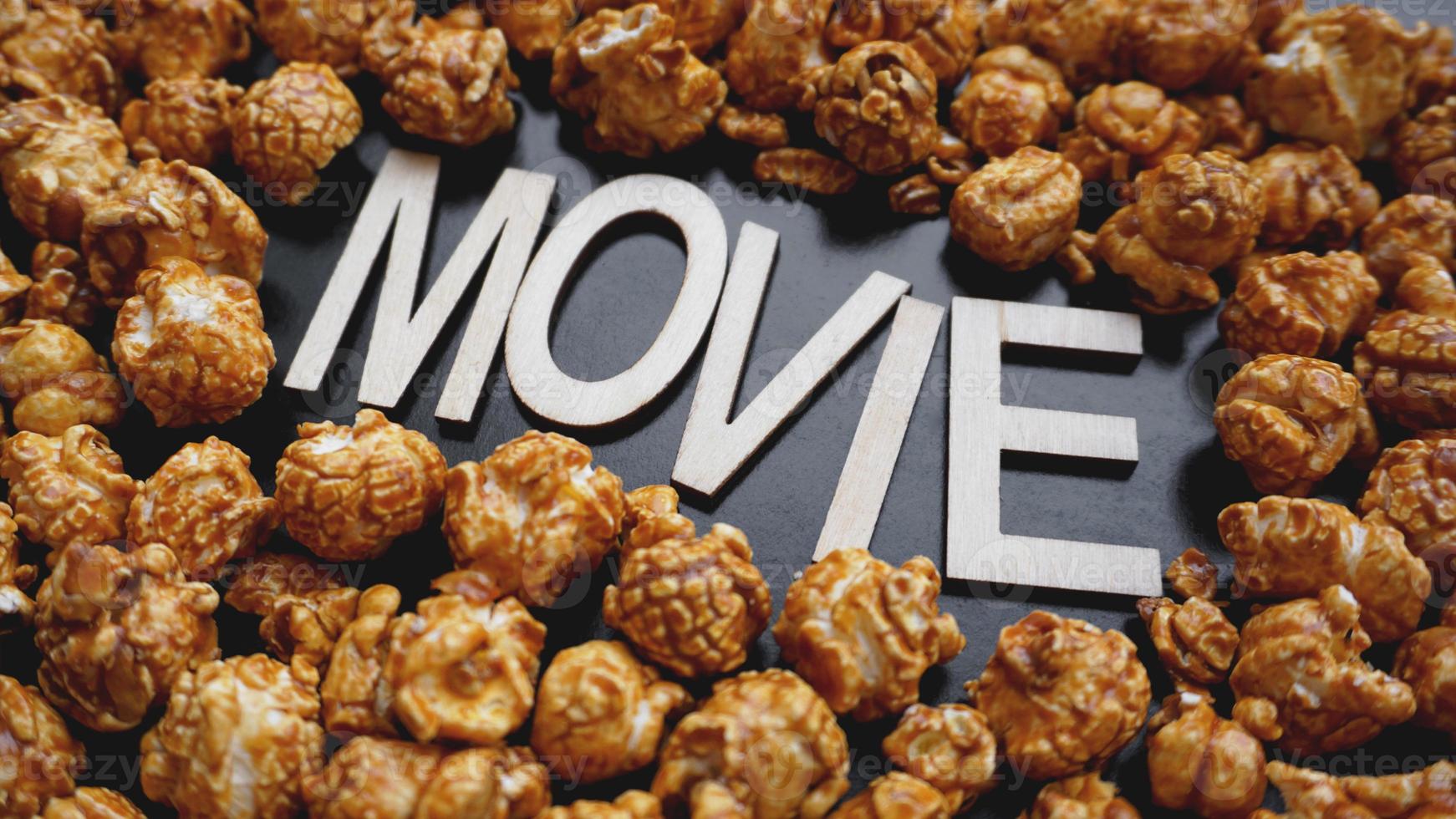 Golden caramel popcorn closeup. Background of popcorn photo