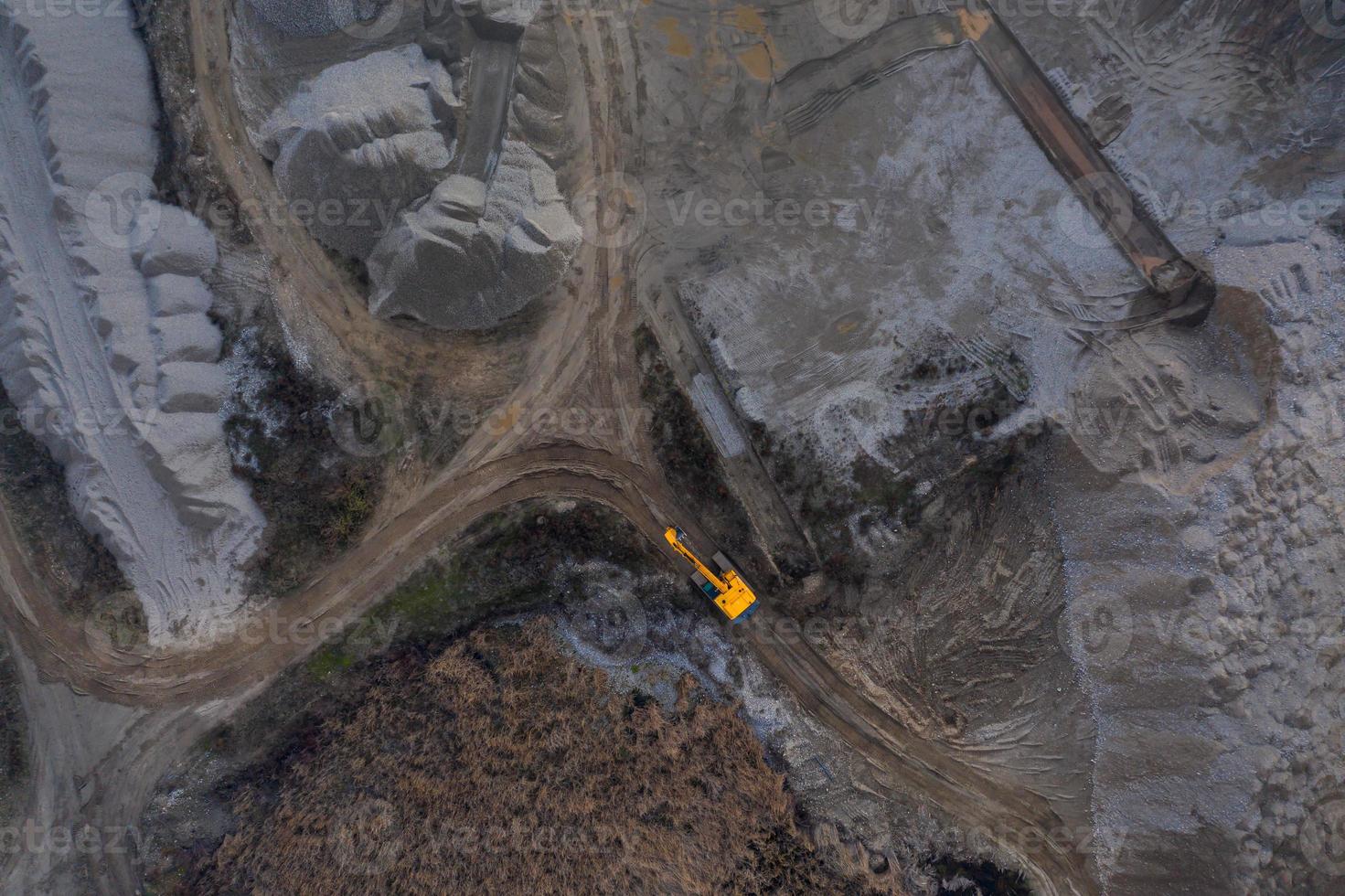 Aerial photo of a yellow digger