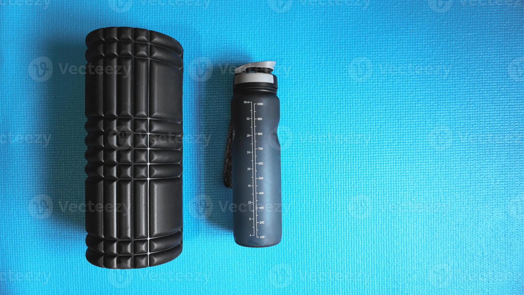 Foam Roller Gym Fitness Equipment Blue background self Myofascial photo