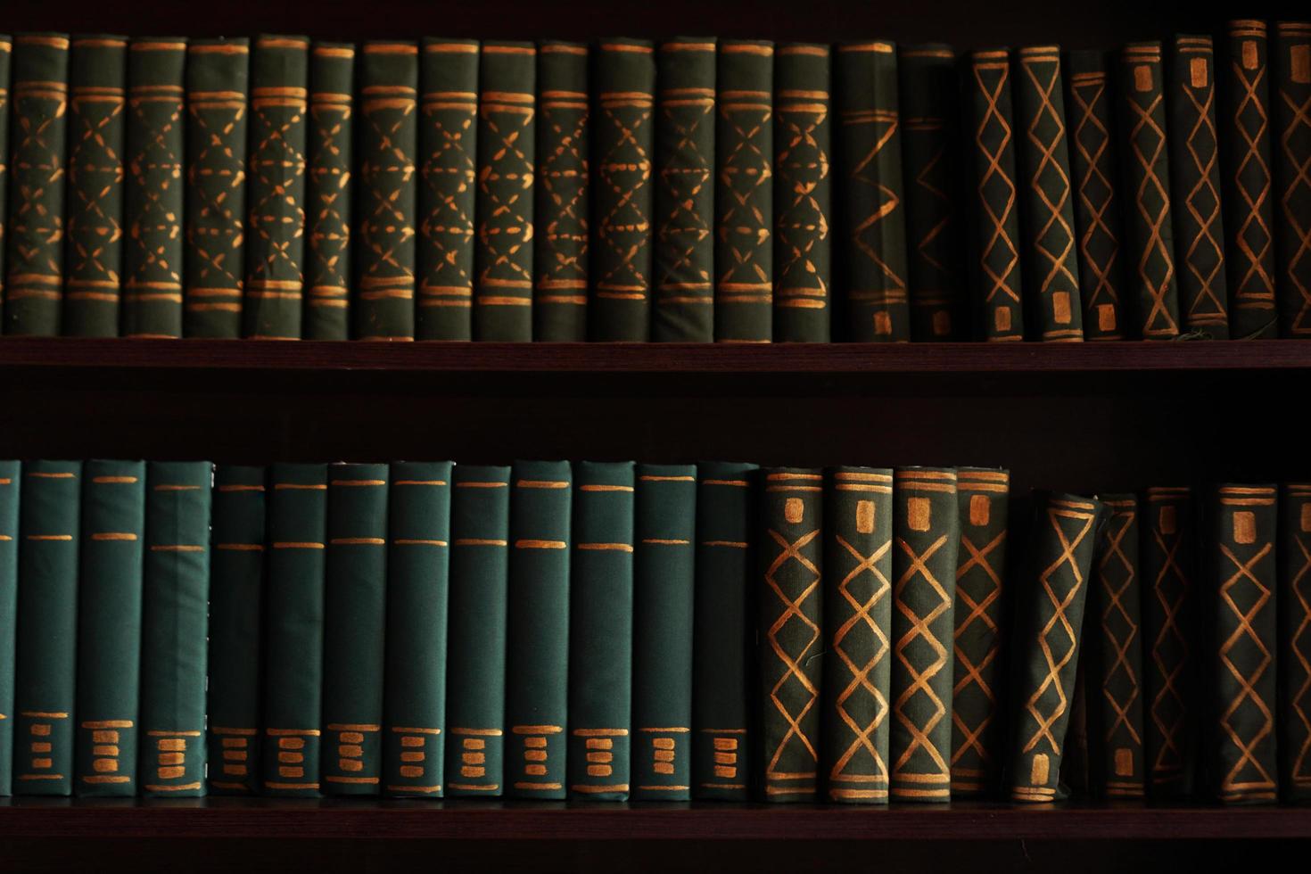 Old books on an archival shelf of library of storehouse photo