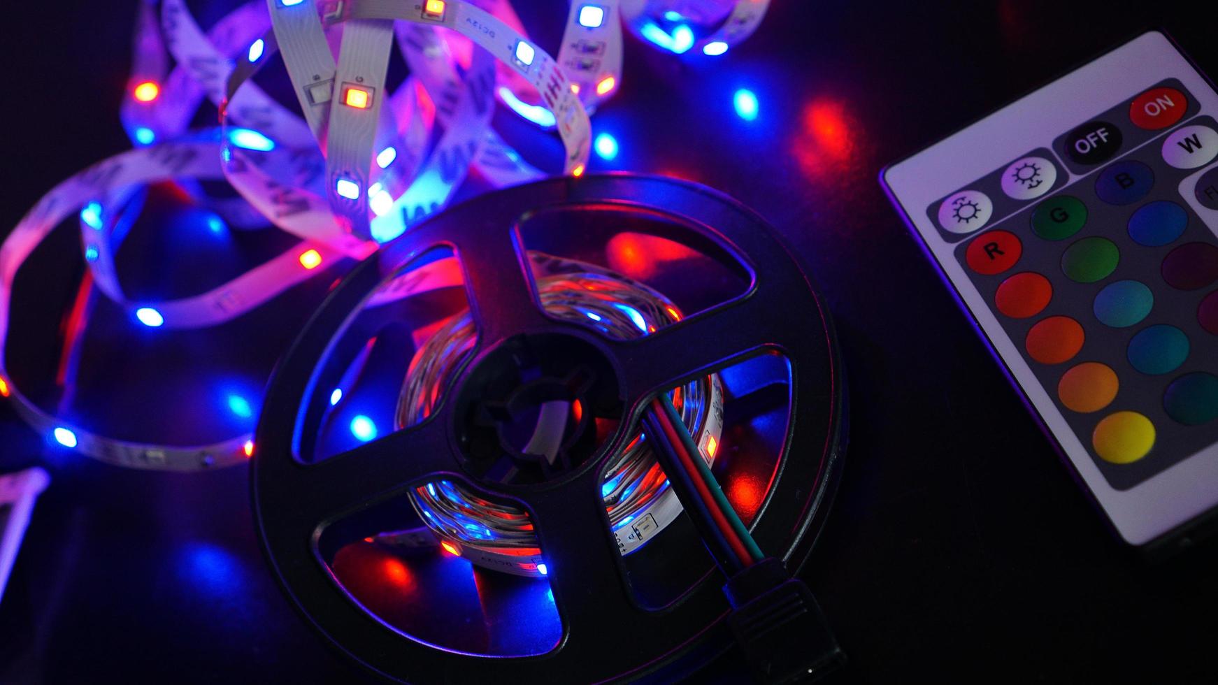 LED strip in purple colors and a control panel for switching colors photo