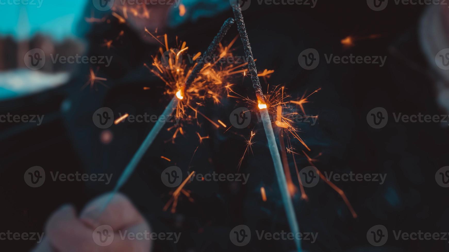 Bengal fire sticks, sparkling, burning, lovers hands fire photo