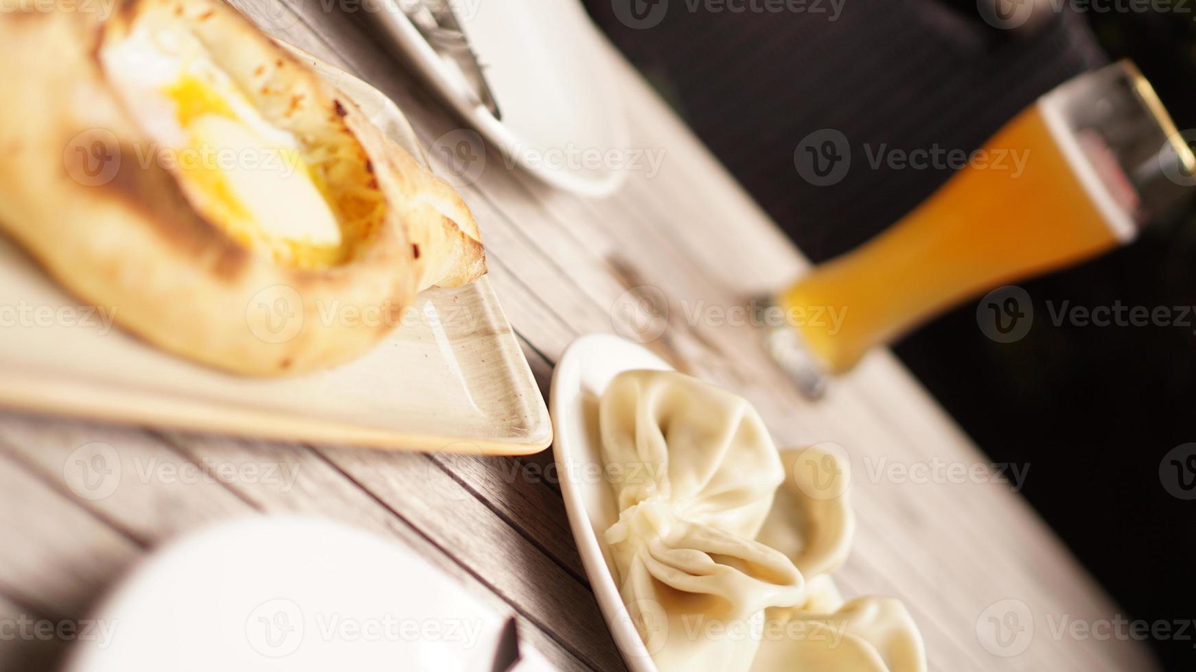 Georgian foodset from Adjara khachapuri and khinkali photo