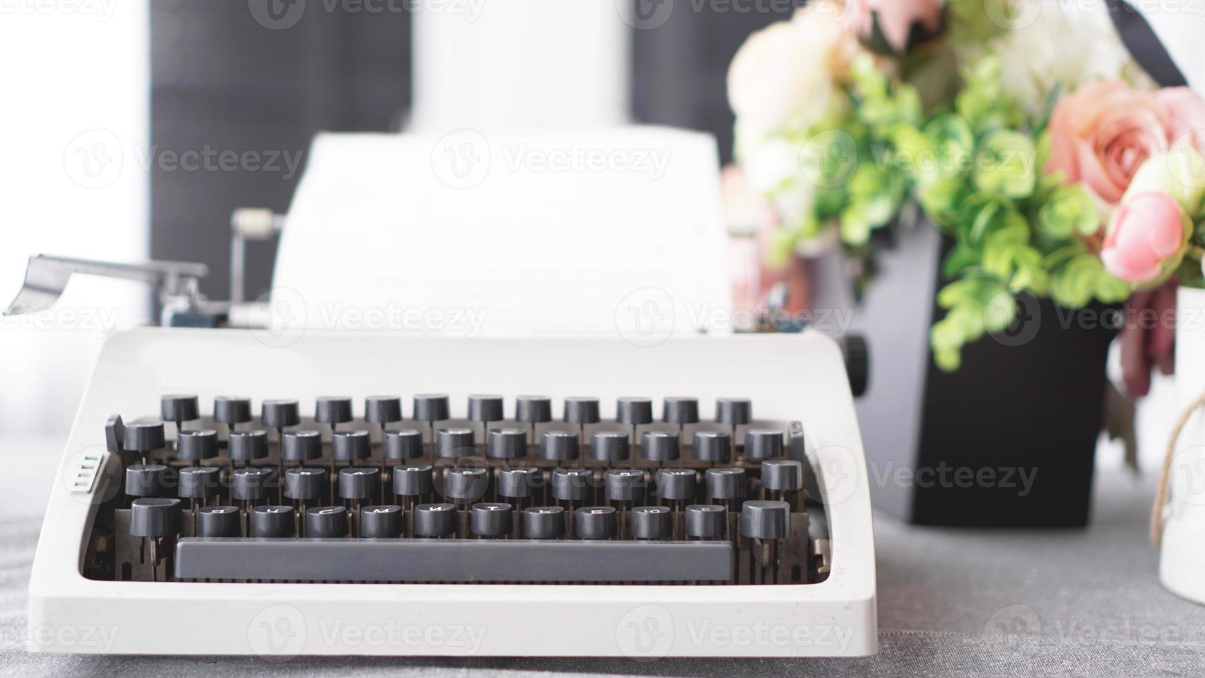 Vintage typewriter with paper. retro machine technology photo