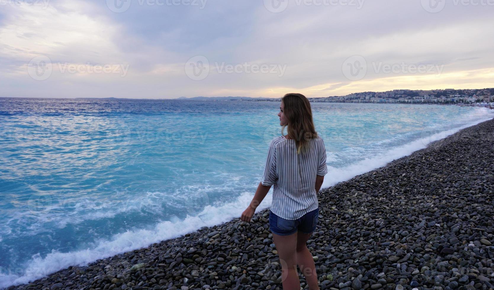 NICE, FRANCE. Young woman enjoying the azure coast photo