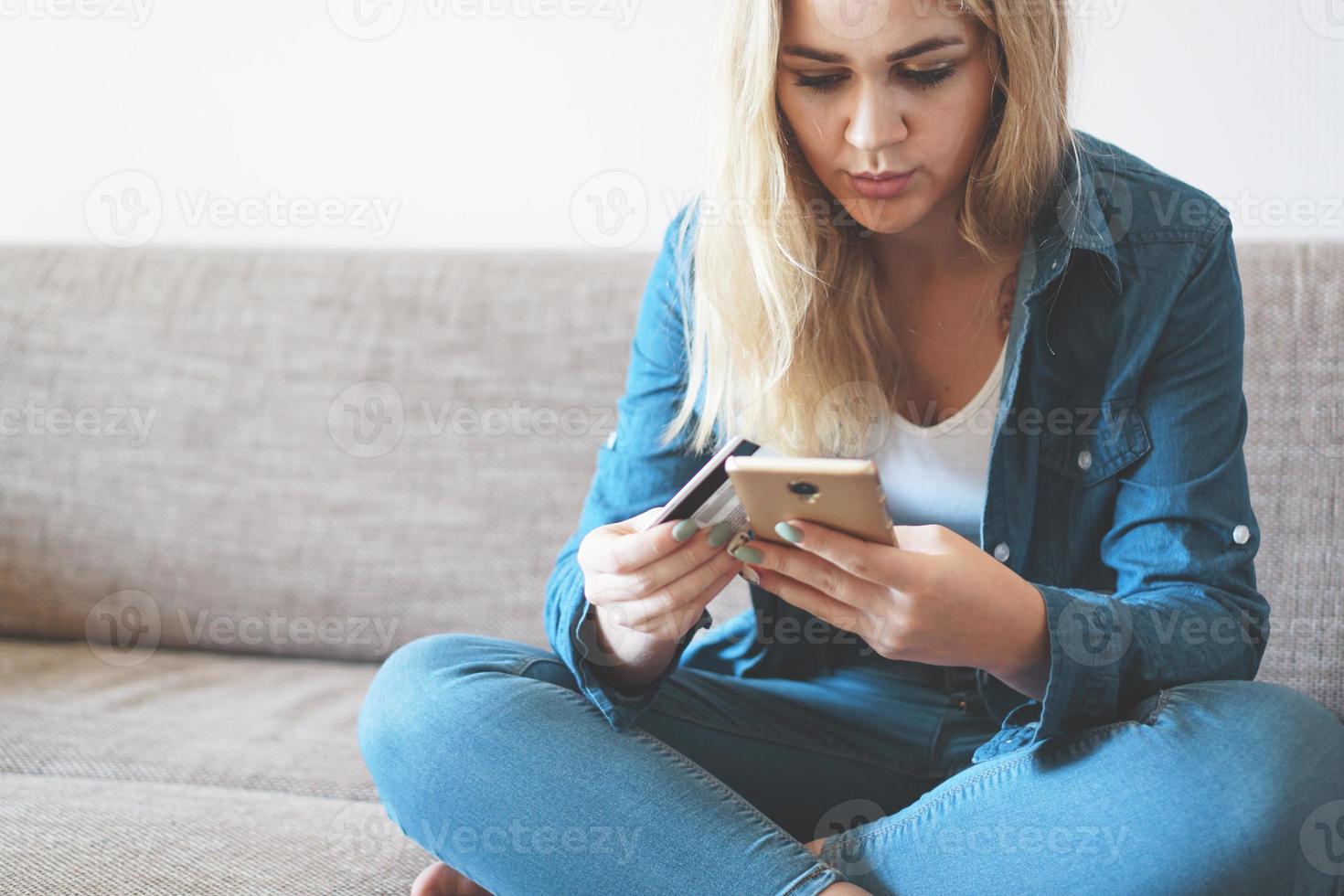 Online payment, Womans hands holding smartphone and using credit card photo