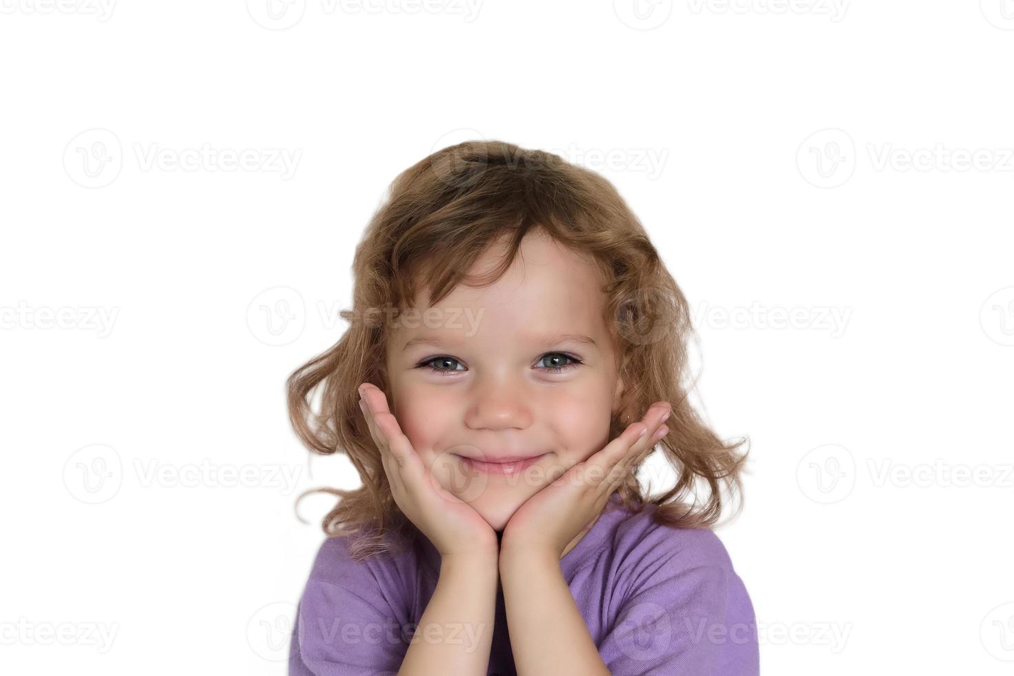 Portrait of a little curly girl on a white background isolated photo
