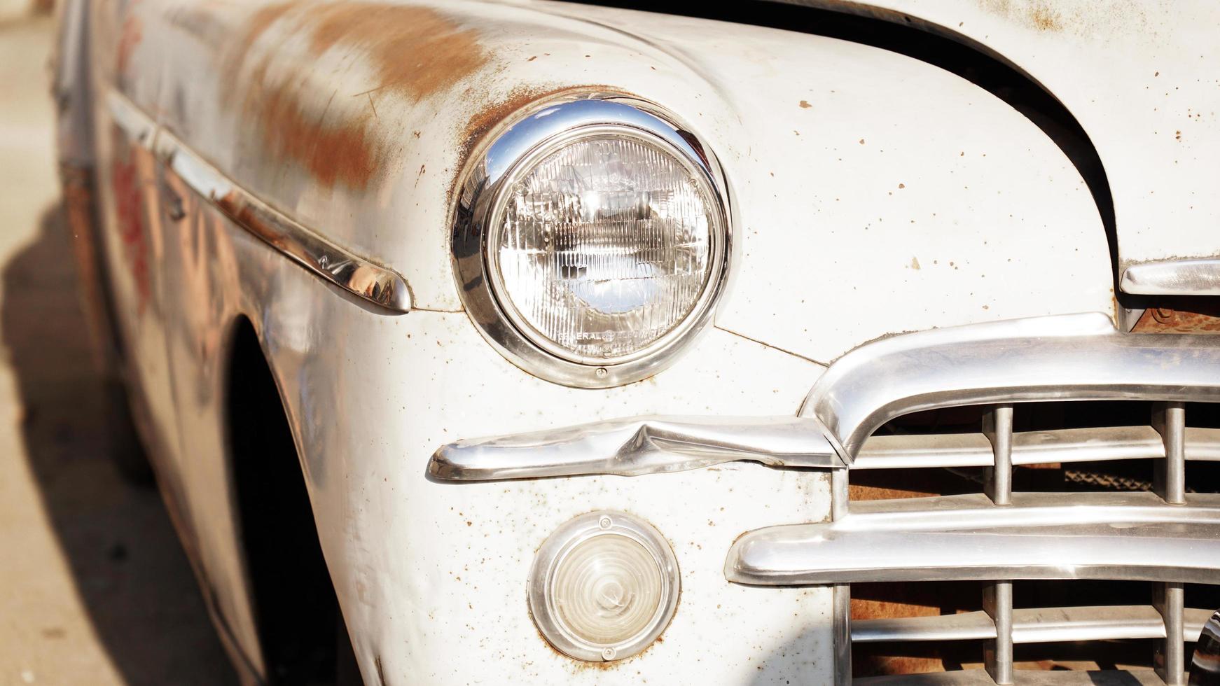 Retro car. Old vintage car. Headlight close up photo