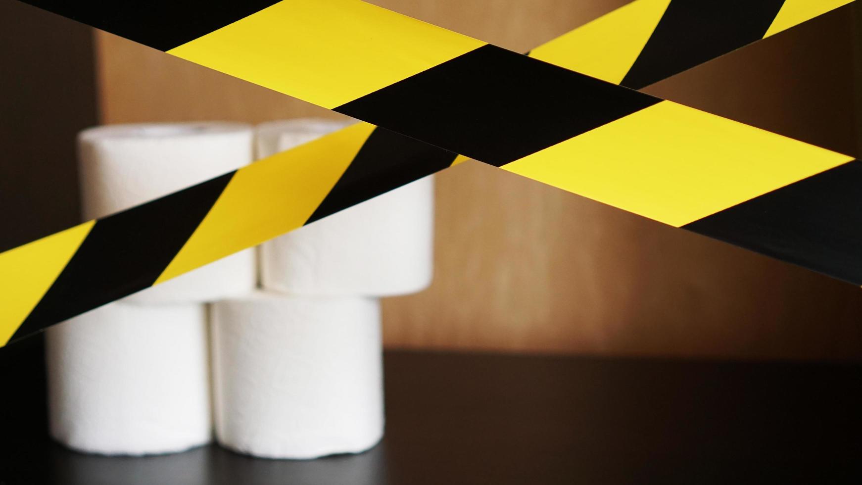Stop panic - coronavirus. Toilet paper behind the tape photo
