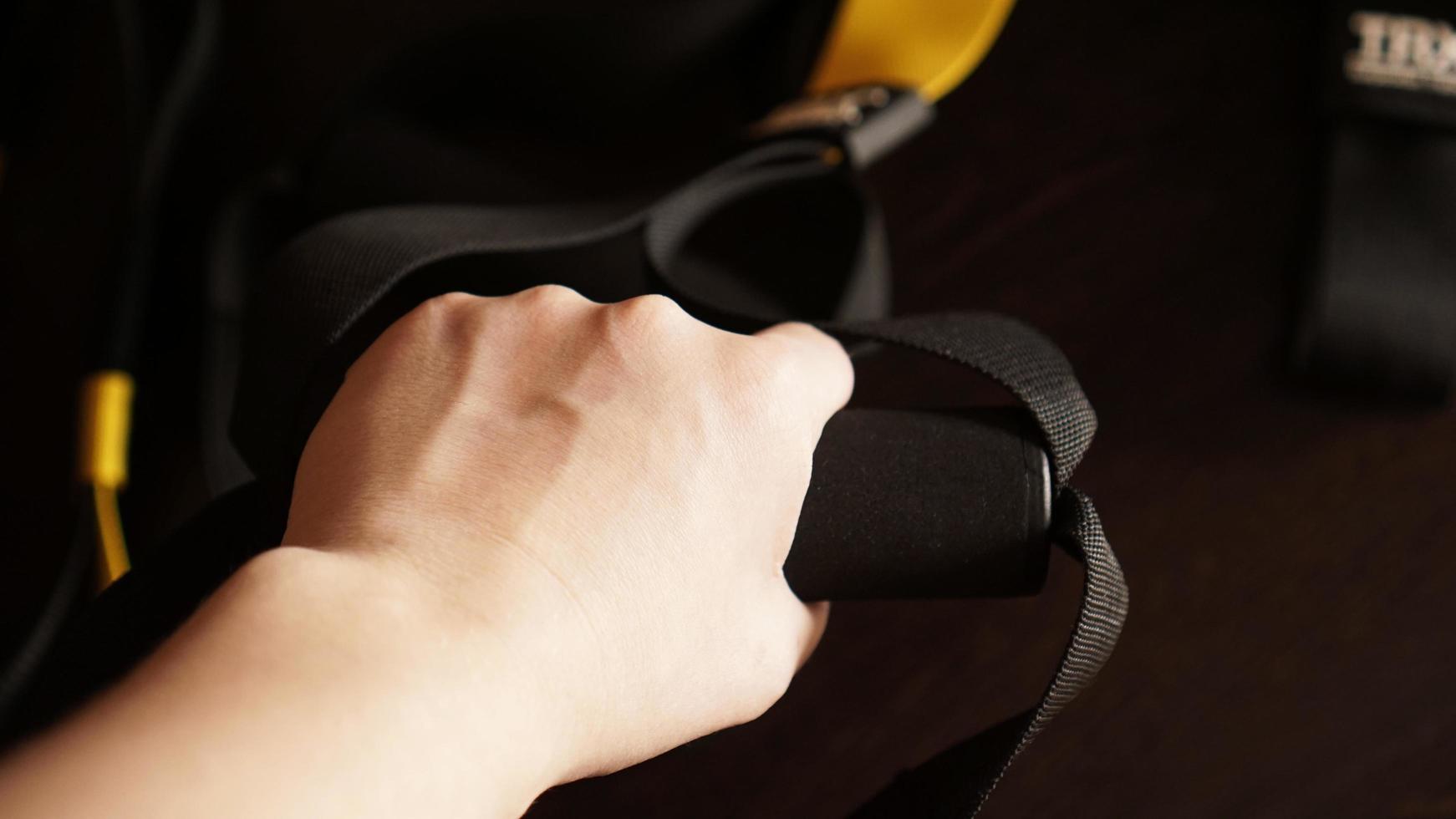 Close up on hands doing suspension training photo