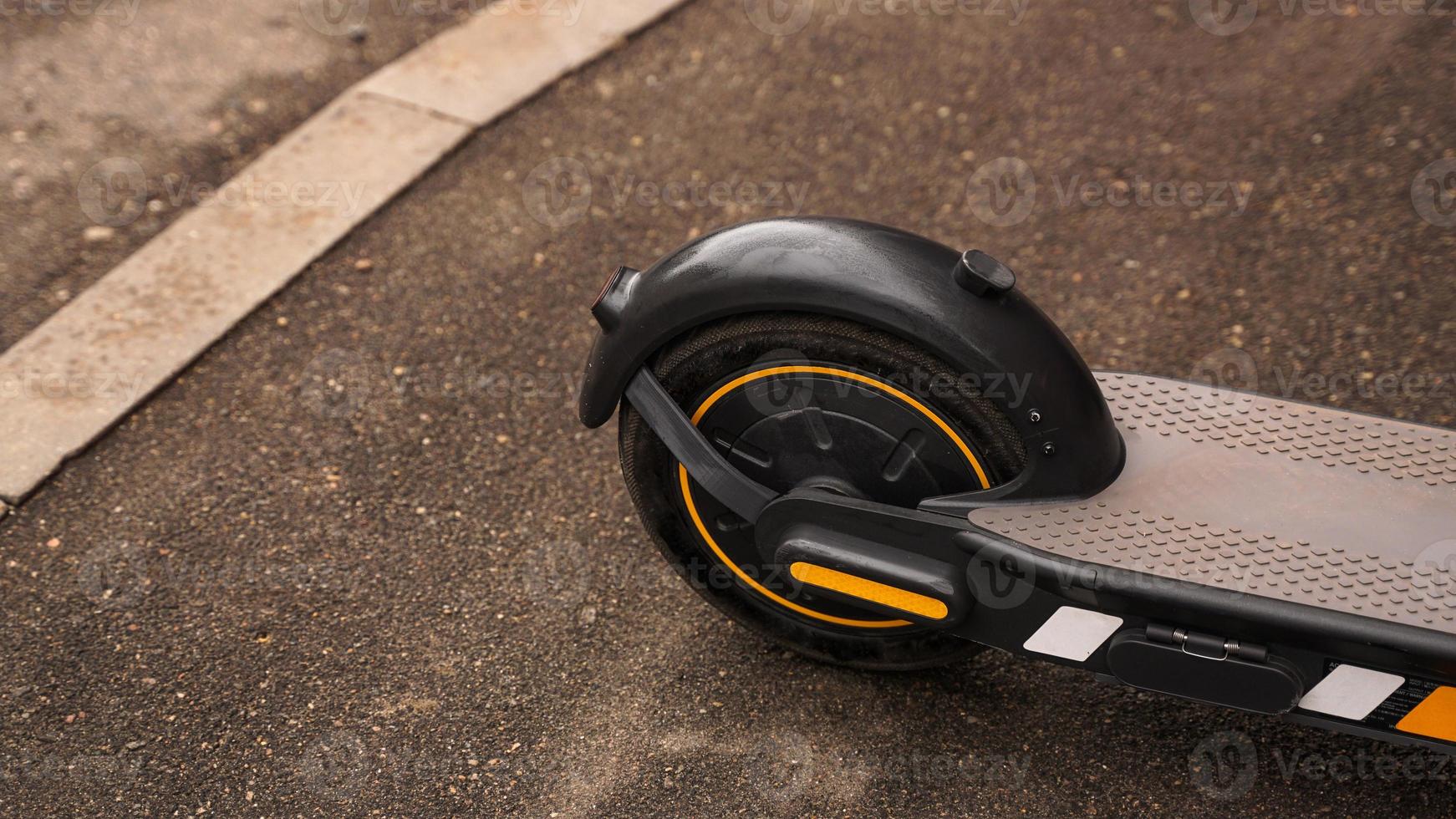 Close-up photo of the rear wheel of an electric scooter.