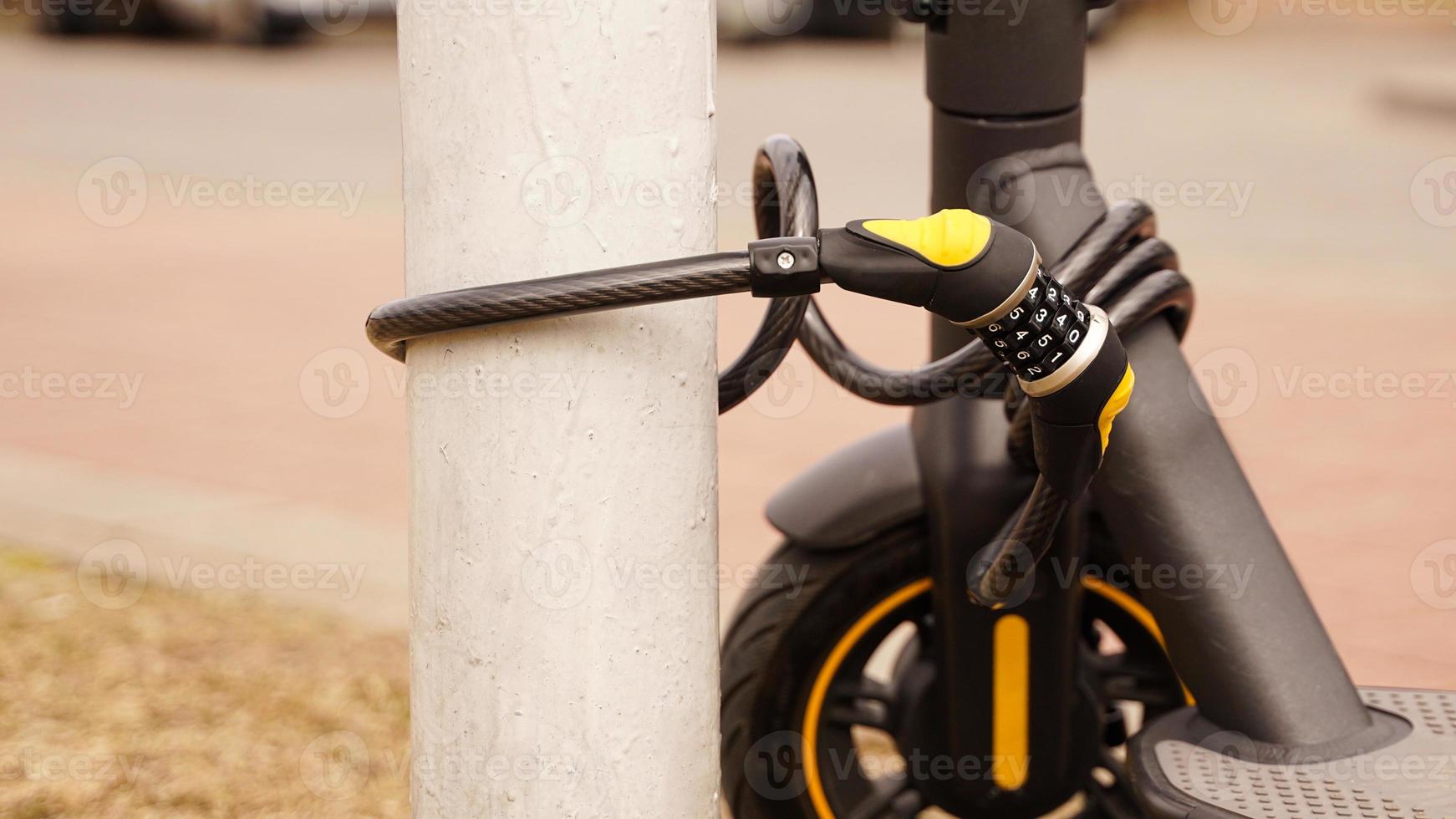 Electric scooter with a combination lock. Anti-theft protection photo