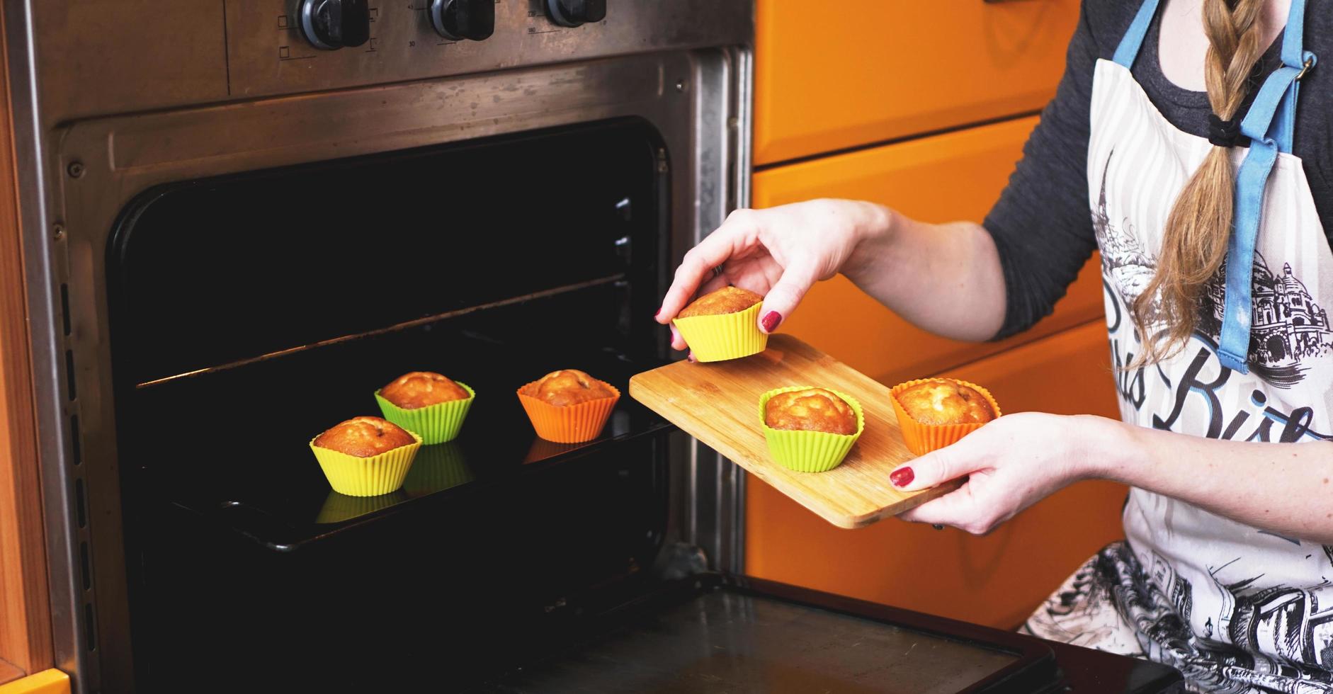 Close-up muffins ready to get out of electric oven photo