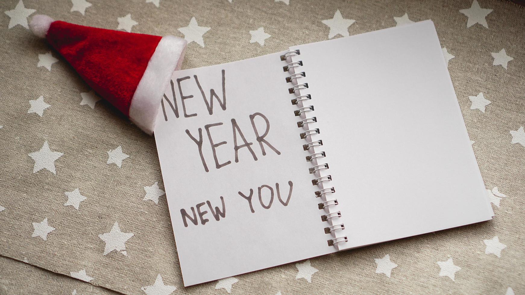 Text new year new you in the new year notebook photo