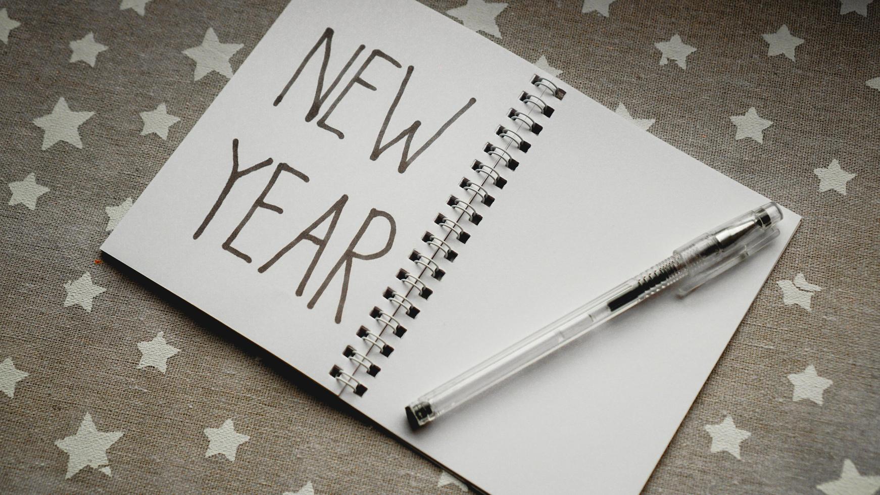 Notebook with pen to write goals of new year photo