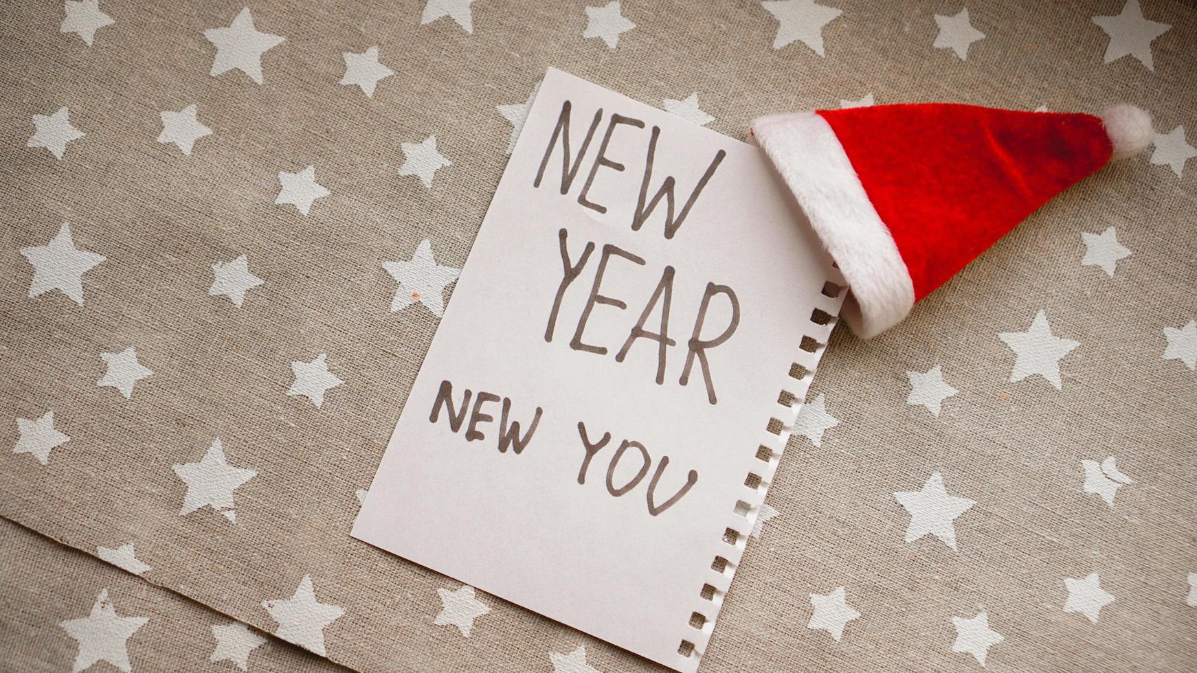 texto año nuevo nuevo tú en el cuaderno de año nuevo foto