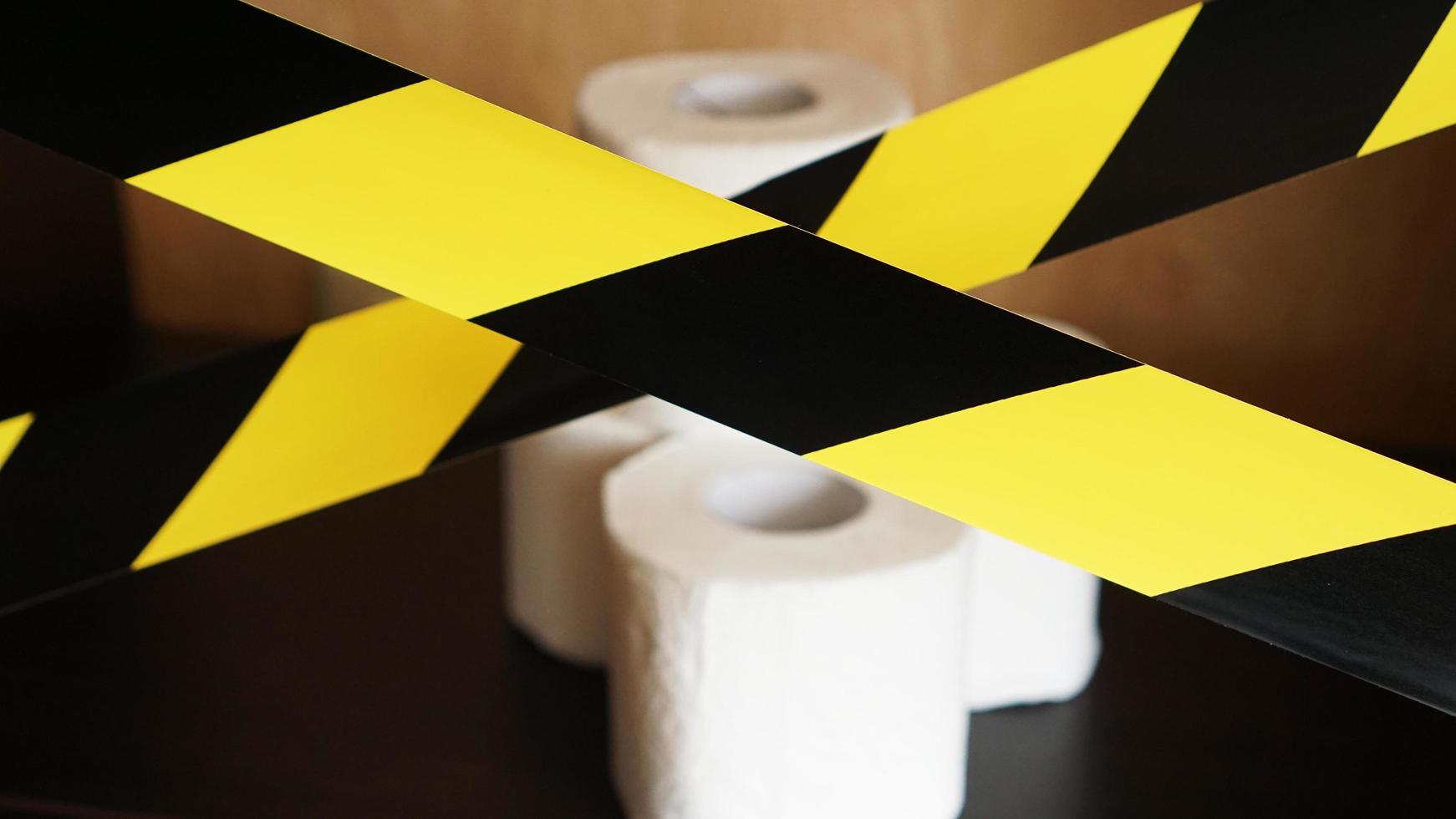 Stop panic - coronavirus. Toilet paper behind the tape photo