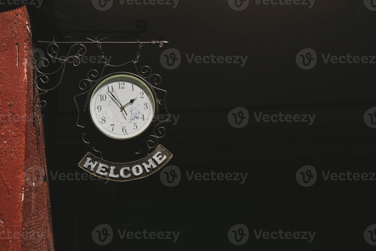 Clock with label Welcome photo