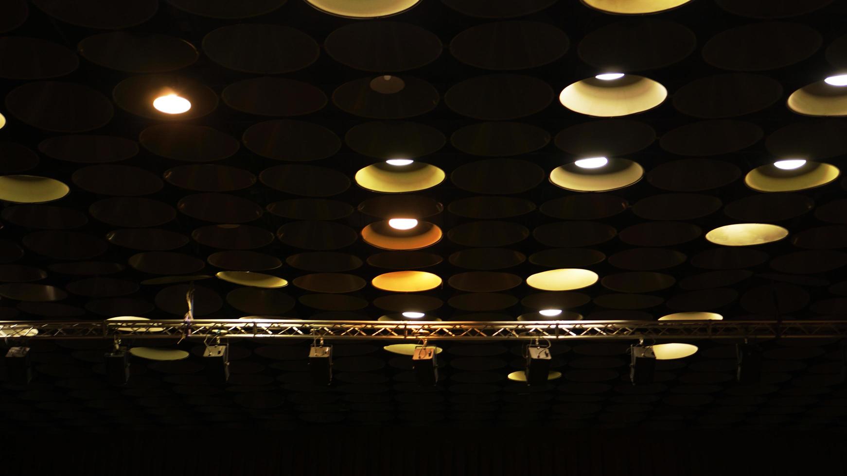 Spot lights in cinema hall on ceiling photo