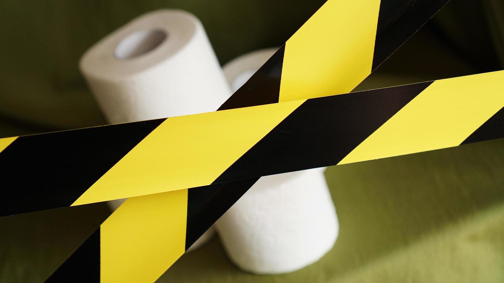 Stop panic - coronavirus. Toilet paper behind the tape photo