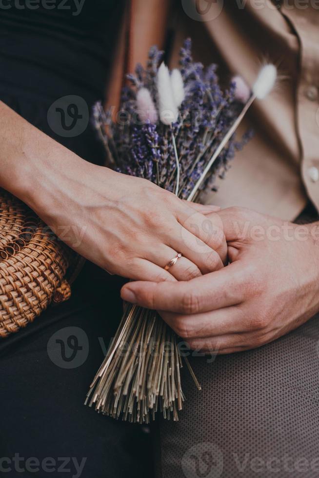 Engagement ring on hand. Love couple holding hands photo