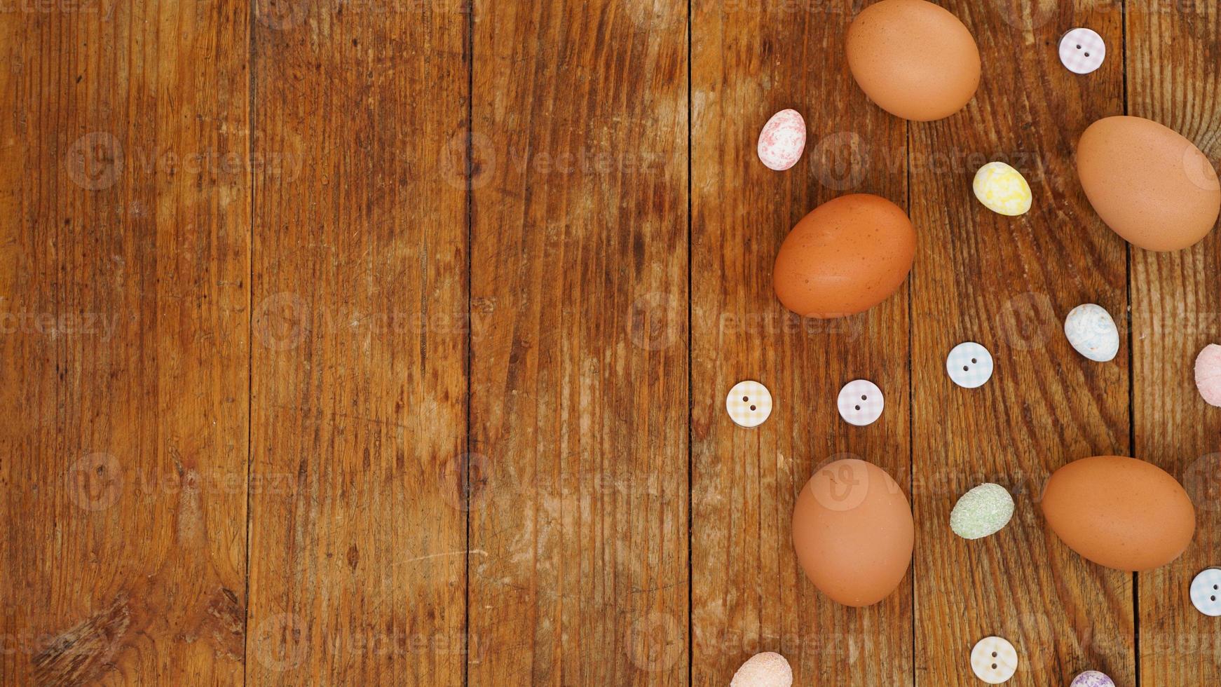 Eggs on a wooden rustic background with copy space for text. photo