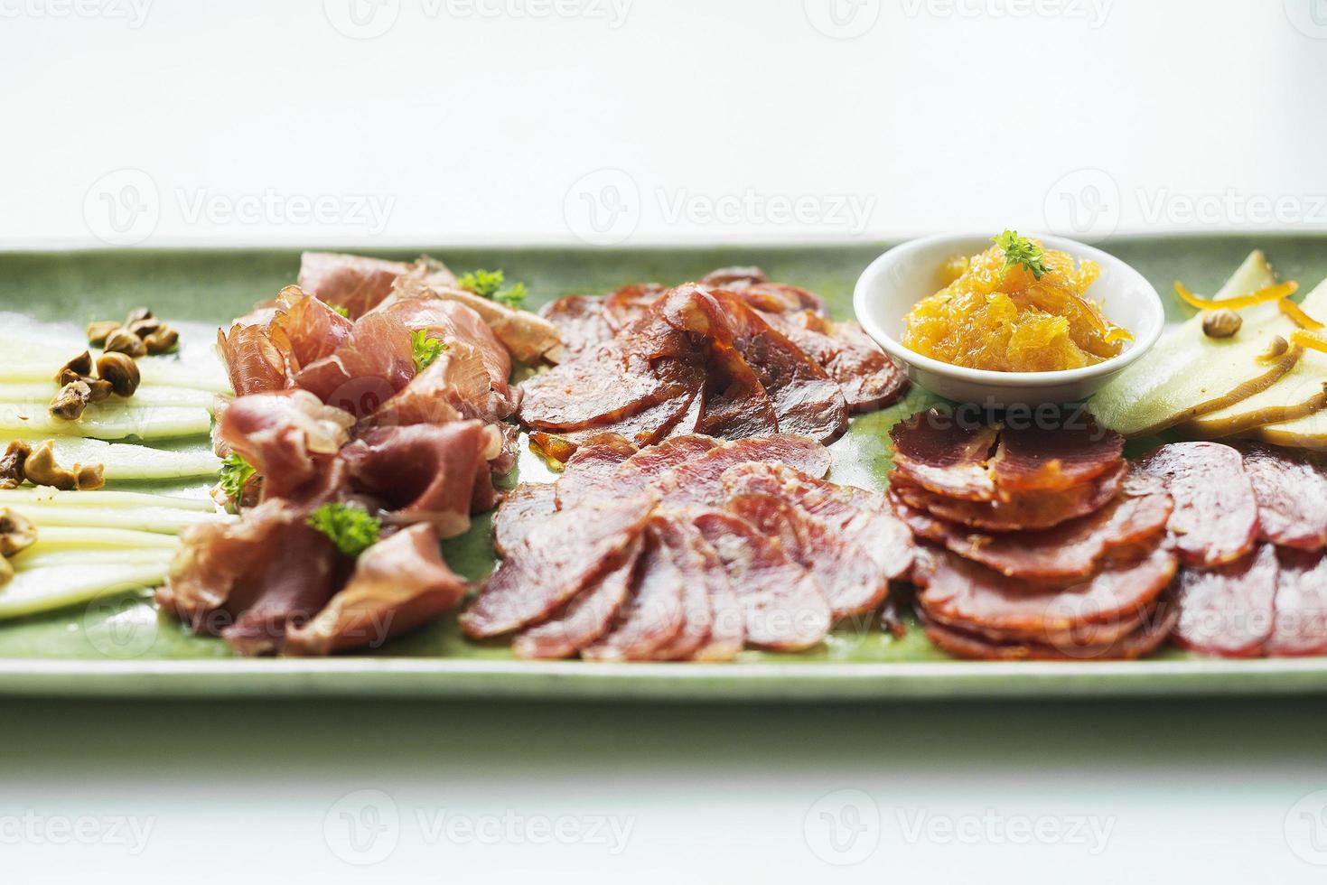 Spanish serrano ham chorizo sausage and cheese tapas traditional snack platter photo