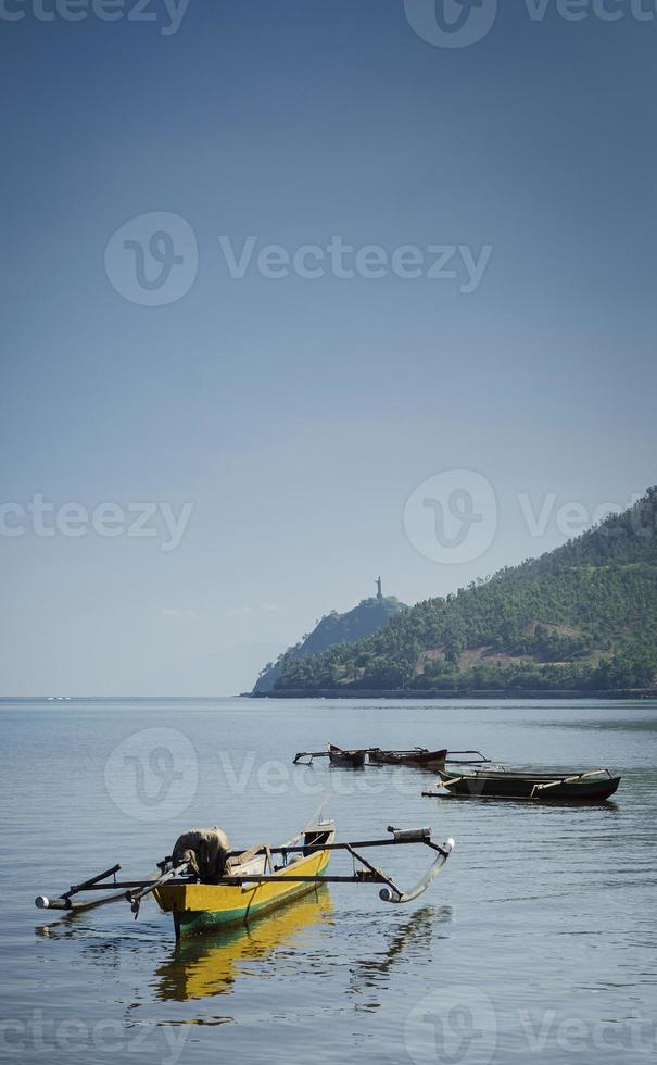 Coast beach landscape view and boat near Dili in east Timor Leste photo