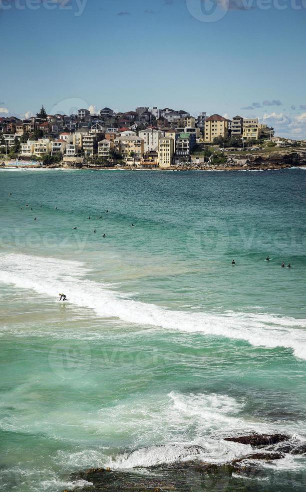 Surfers in famous Bondi beach in Sydney Australia on sunny summer day photo