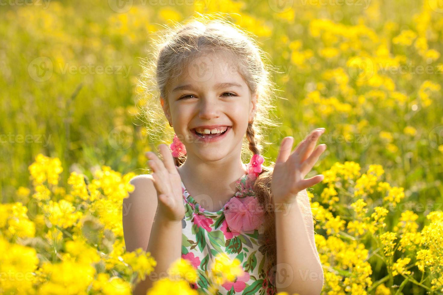Blonde girl claps his hands photo