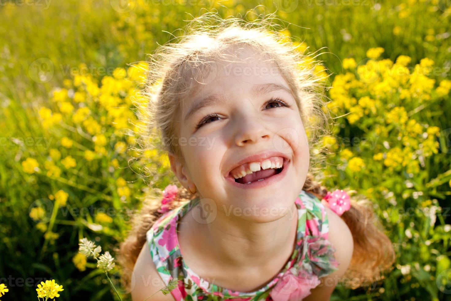 Portrait of a cheerful little girl photo