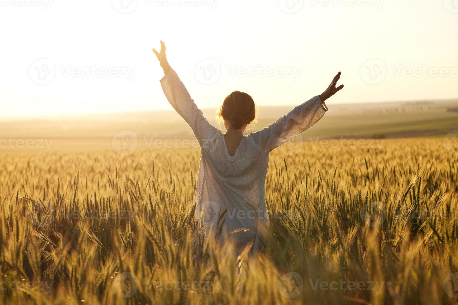 Woman with arms outstretched photo