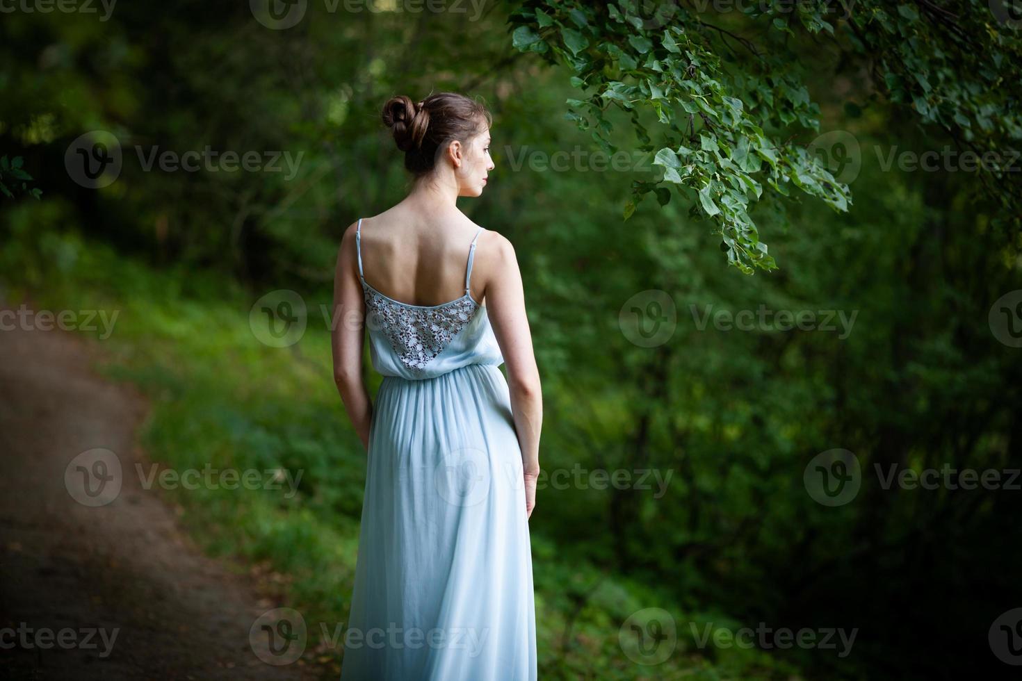 Photographed from the back of a young woman photo