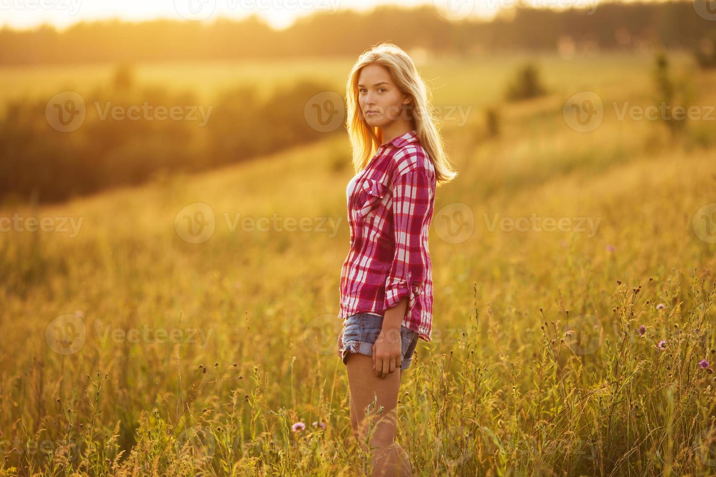 Beautiful girl in the summer evening photo