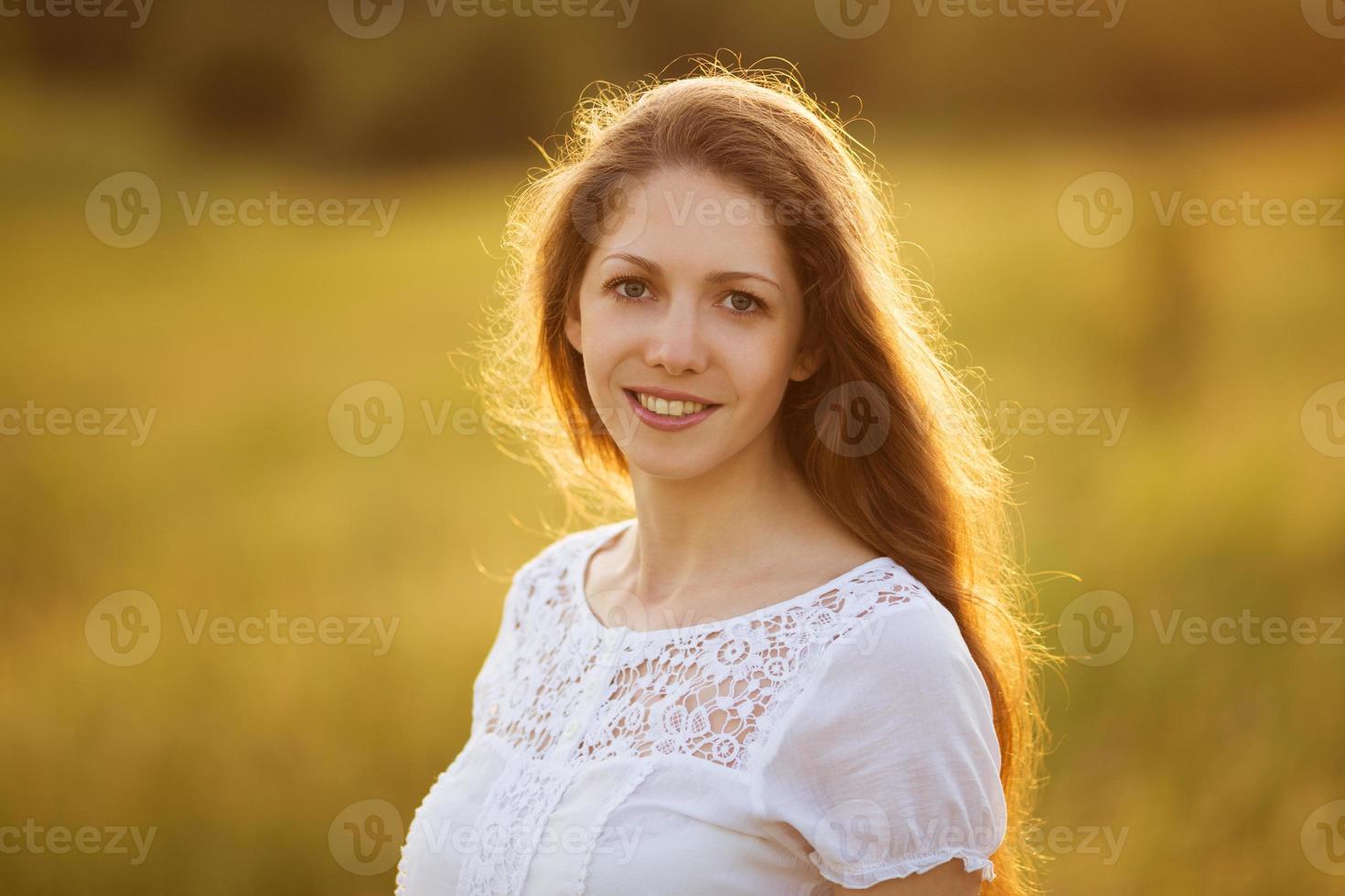 Happy girl with long dark hair photo