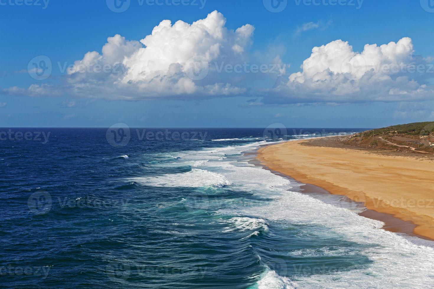 Landscape with ocean and cloudy blue sky photo