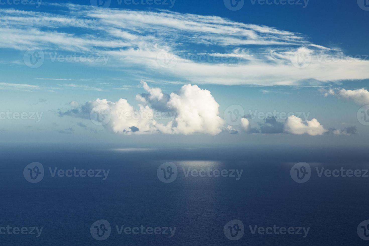 Big cloud hung over the ocean photo