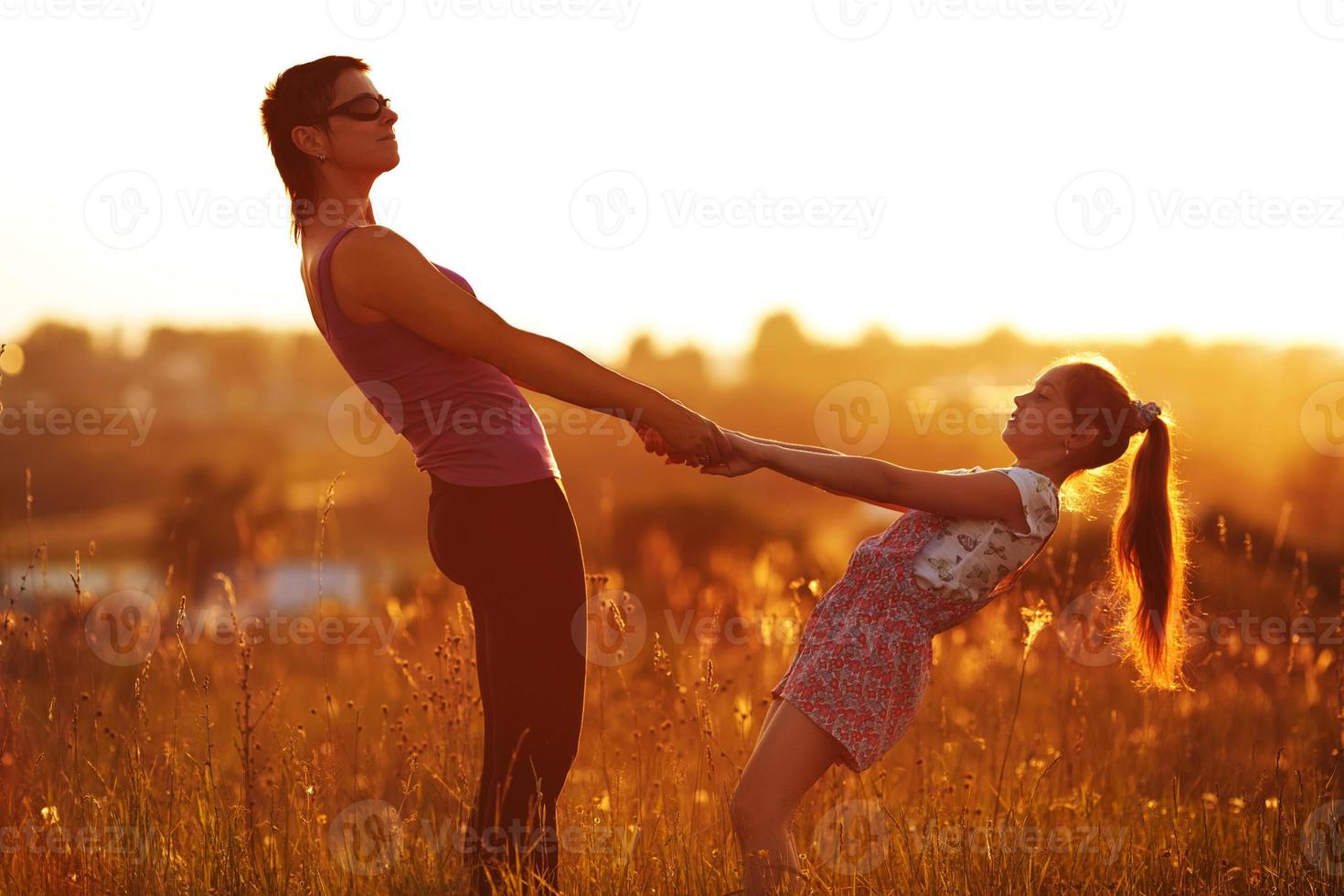 Mother and daughter are holding hands photo