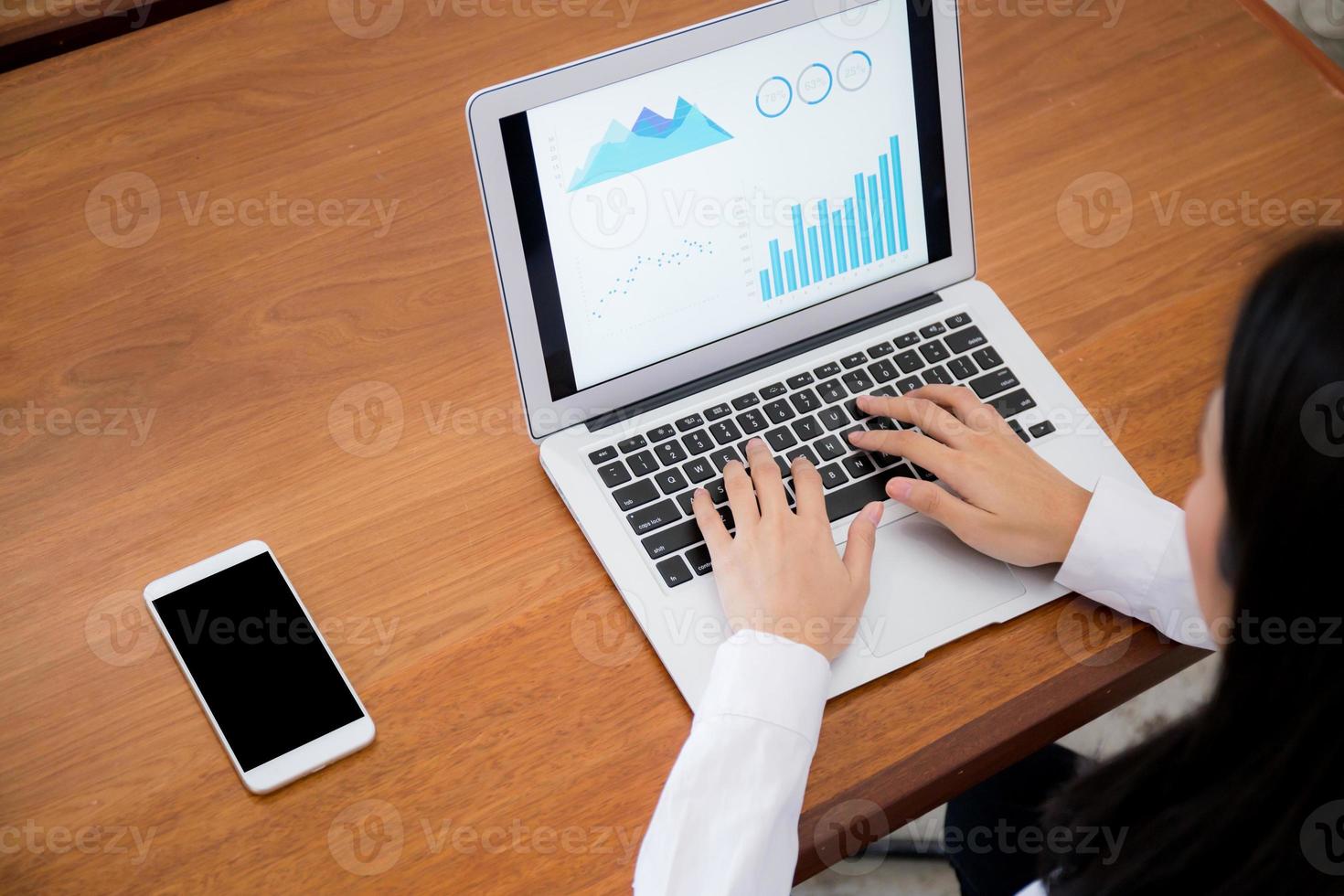 Closeup business woman work with finance and planing on laptop. photo