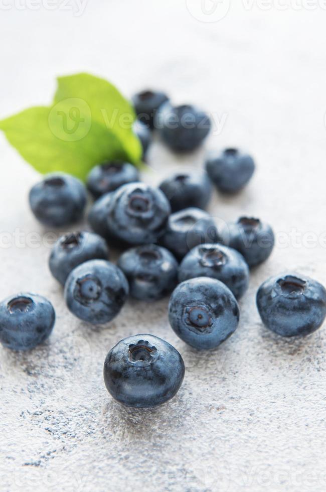 Blueberries on grey concrete background photo