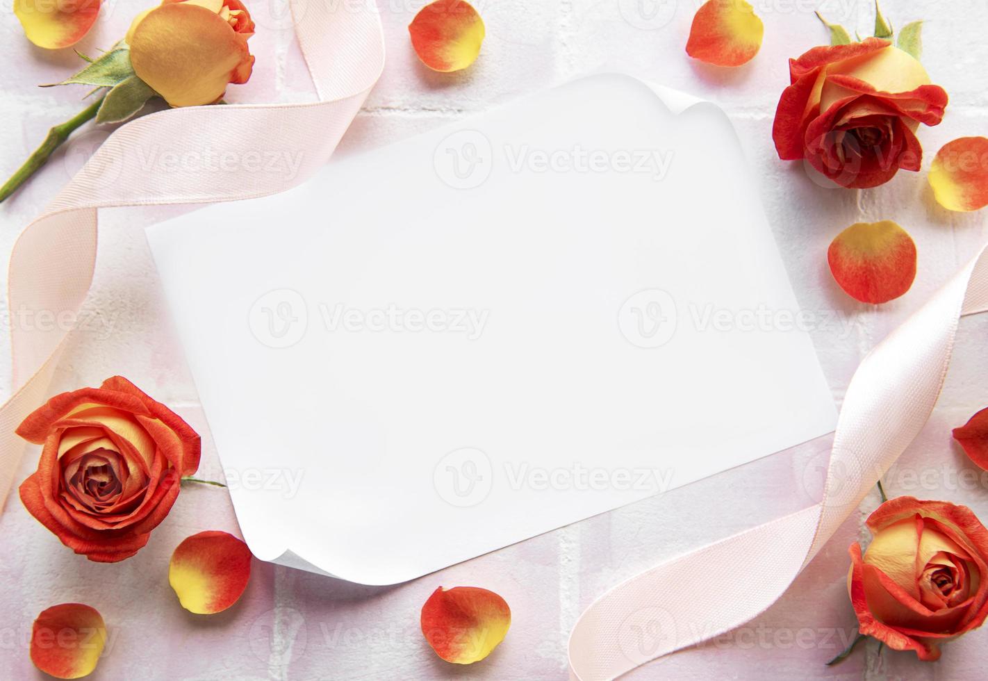 Flowers composition. Frame made of red  roses and petals photo