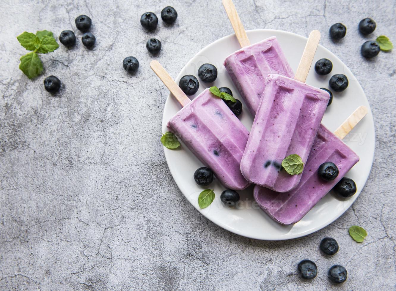 Ice cream popsicles from fresh organic blueberries. photo