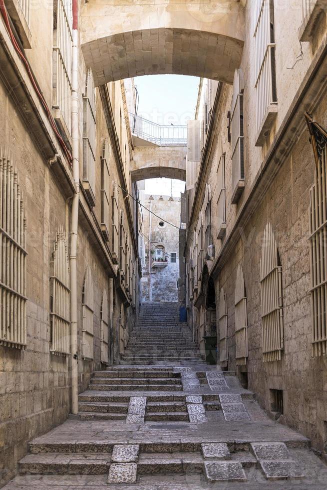 Old town cobbled street scene in ancient Jerusalem city Israel photo