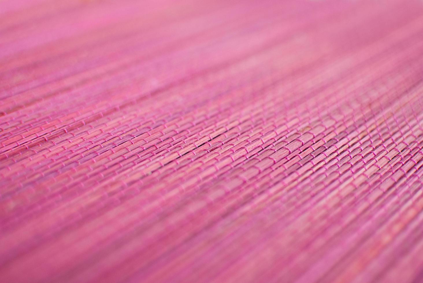 Bamboo pink straw mat background photo