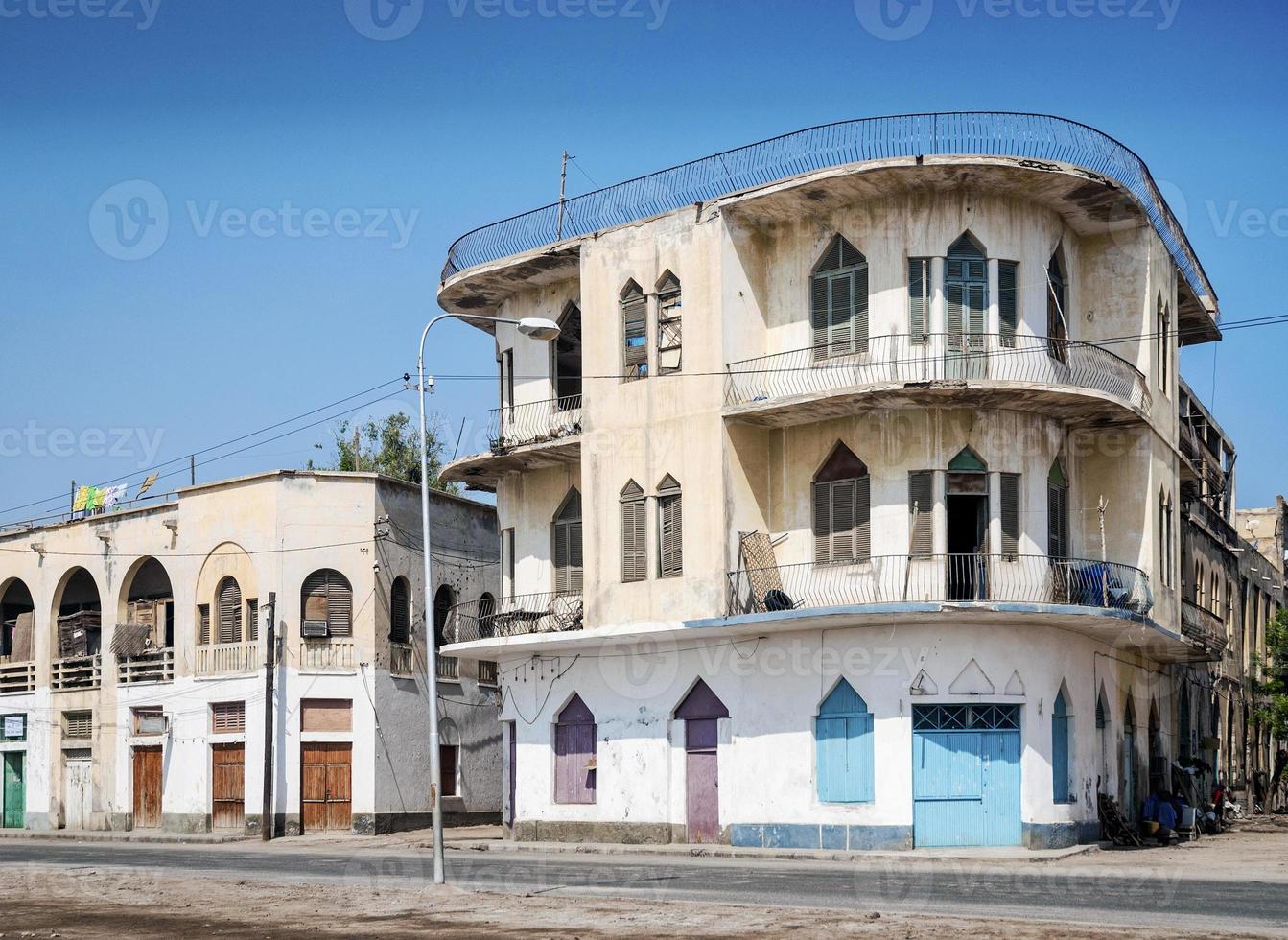 Local red sea style architecture street in central Massawa old town Eritrea photo