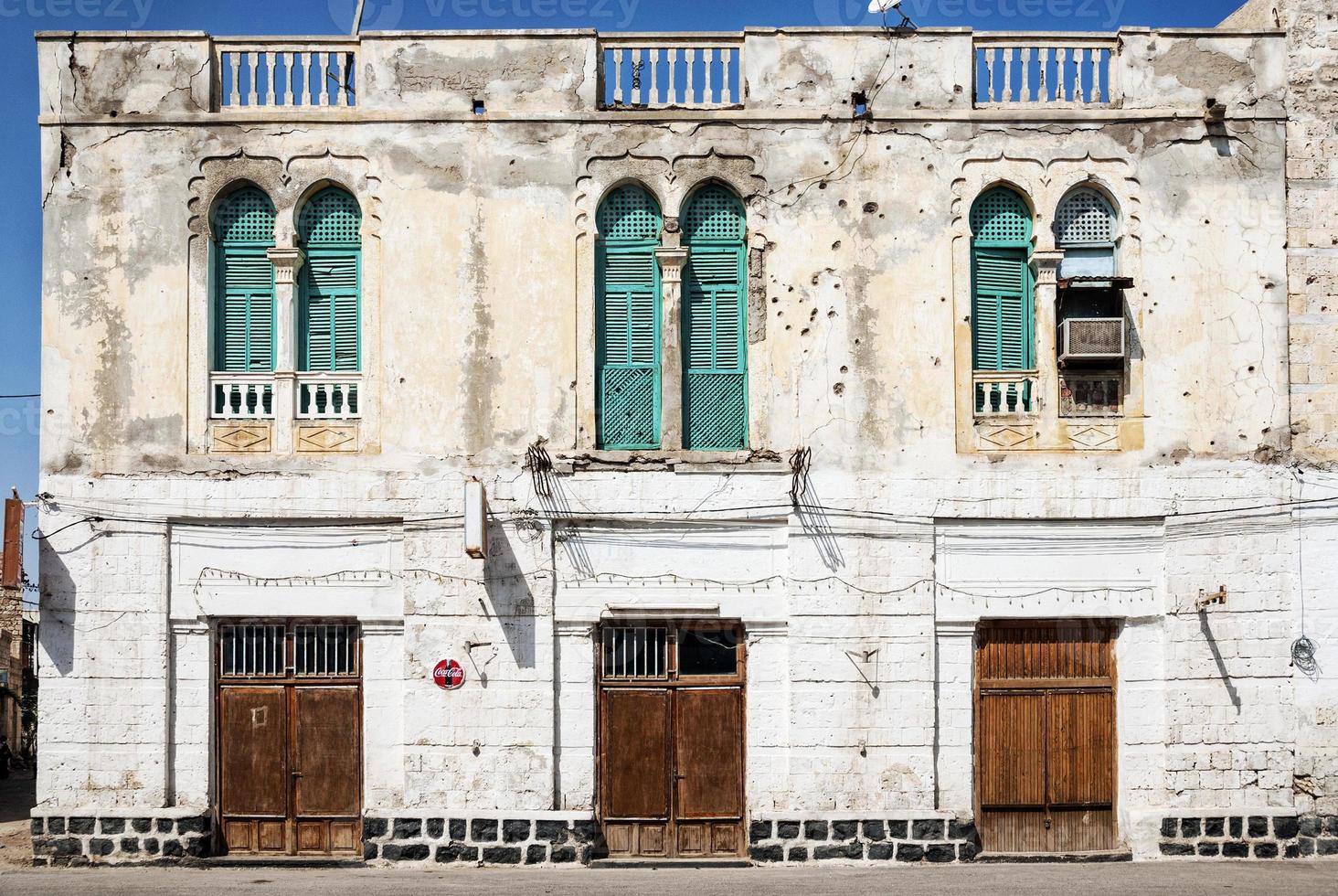 Local red sea style architecture street in central Massawa old town Eritrea photo