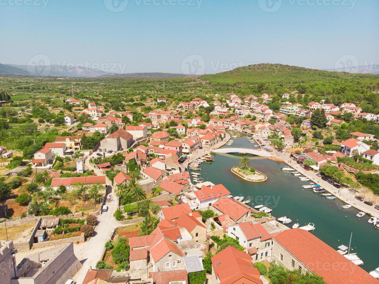 Bay and old city with church in Vrboska on Hvar island Croatia photo